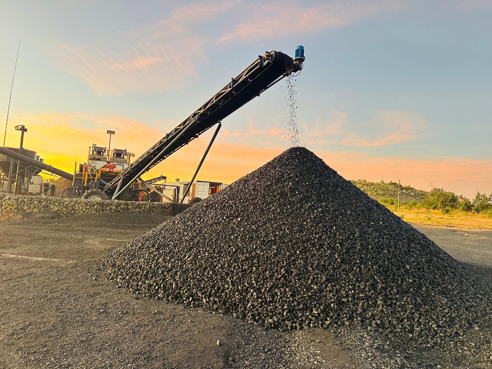 Conveyor discharging onto the product stockpile at sunset